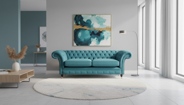 Sofá Chesterfield de diseñador de 3 plazas de lujo en el salón de color turquesa.