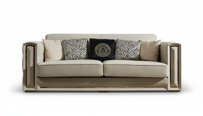 Sofá Chesterfield de cuero beige, sofisticado diseño de sala de estar con cojines.