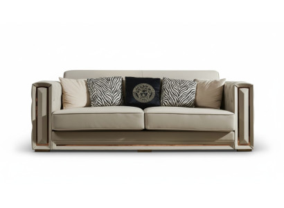 Sofá Chesterfield de cuero beige, sofisticado diseño de sala de estar con cojines.