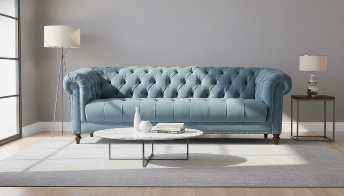 Chesterfield sofá tapizado en tela diseño Turquesa, Nuevo, para tres personas en la sala de estar.