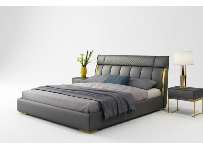 Moderno dormitorio de cuero gris con incrustaciones de acero inoxidable dorado.