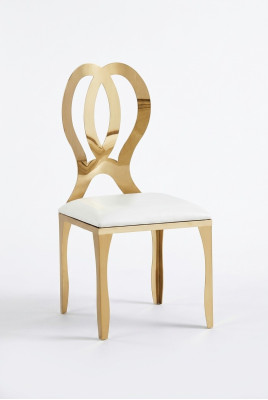 Silla de diseño de comedor con asiento tapizado de acero inoxidable sólido y tela.
