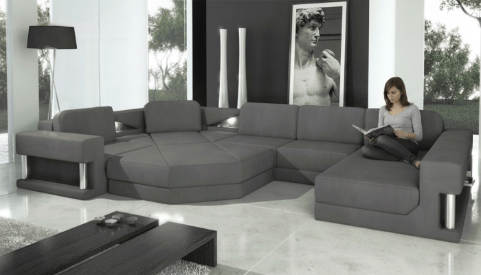 Sofá de diseño tapizado en tela moderna con función de cama en forma de U.