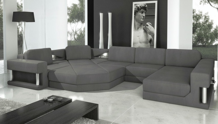 Sofá de diseño tapizado en tela moderna con función de cama en forma de U.