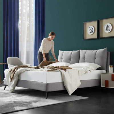Doble cama de hotel en cuero beige de 180x200 diseño de dormitorio con cabecero acolchado.