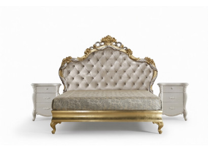 Hermosa cama de estilo clásico con cabecero tallado.