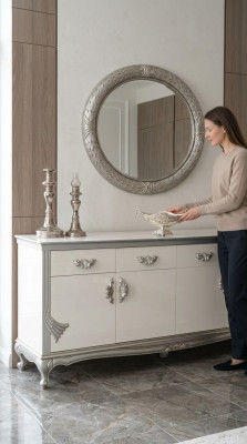 Cómoda blanca con cajones prácticos y estantes elegantes.