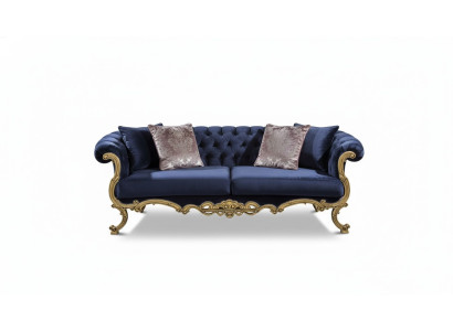 Sofá de tres plazas Chesterfield en un lujoso color azul para la sala de estar.