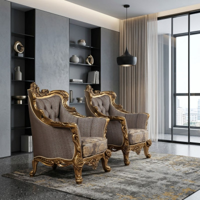 Una lujosa butaca clásica en gris oscuro con diseño barroco dorado de Chesterfield.
