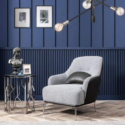 Sillón orejero moderno de tela de poliéster en color gris para la sala de estar.