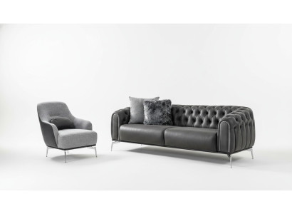 Sofá Chesterfield de 4 plazas en cuero negro artificial.