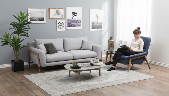 Sofá de 4 plazas de tela de diseño moderno en color gris.
