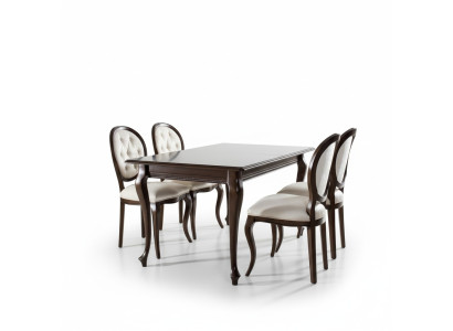 Mesa de comedor de madera marrón oscuro con 5 sillas clásicas de cuero Chesterfield de diseñador.