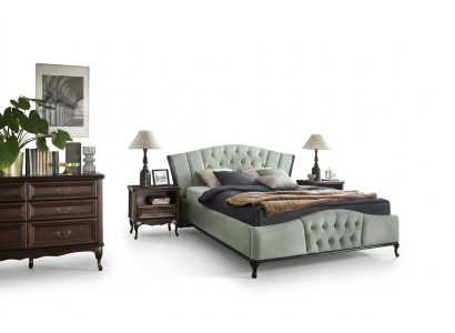 Cama Chesterfield verde con muebles de dormitorio de madera Camas Reales.