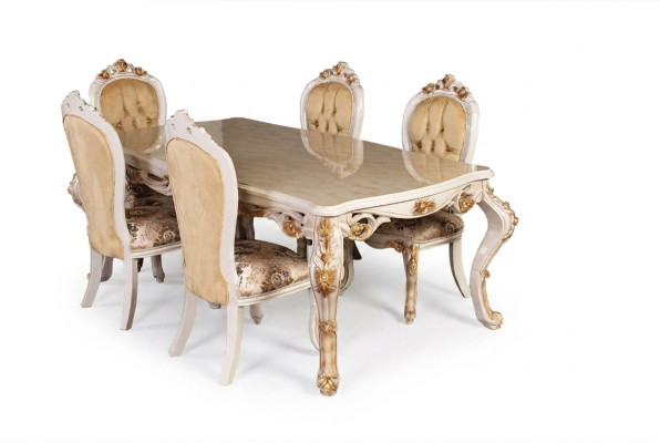 Muebles clásicos para el comedor en color beige. Mesa de comedor diseñada con sillas tapizadas estilo Chesterfield.