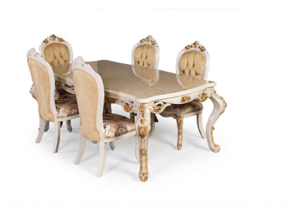 Muebles clásicos para el comedor en color beige. Mesa de comedor diseñada con sillas tapizadas estilo Chesterfield.