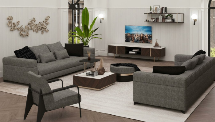 Sillón gris con patas de acero inoxidable. Muebles de salón modernos. Sillón sofá.