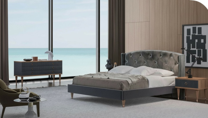Juego de dormitorio gris de lujo con cama doble, 2 mesitas de noche y cómoda.