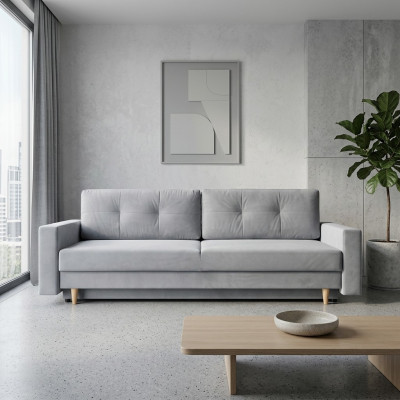 Cómodo y funcional sofá extensible de 3 plazas en color gris claro de estilo moderno.