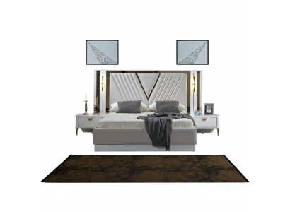 Cama de 2 habitaciones con decoraciones doradas y mesitas de noche a juego.