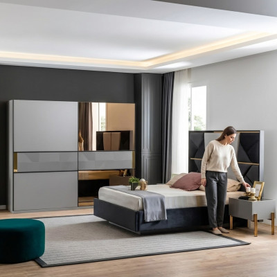 Juego de muebles de dormitorio perfecto en tonos grises con incrustaciones doradas.