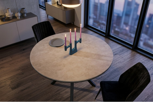 Mesa de comedor redonda extensible en madera gris.
