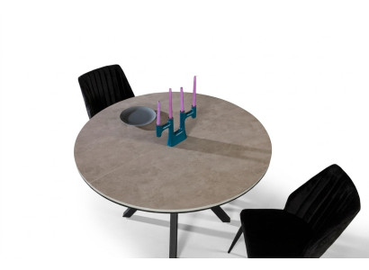 Mesa de comedor redonda extensible en madera gris.