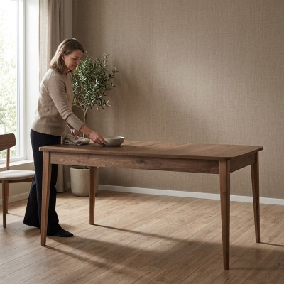 Mesa de comedor extensible de madera marrón de 160 cm.
