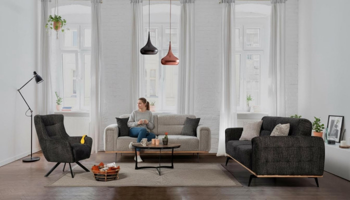 Conjunto de sofás gris oscuro y gris, lujosos sillones de tela, muebles de salón modernos.