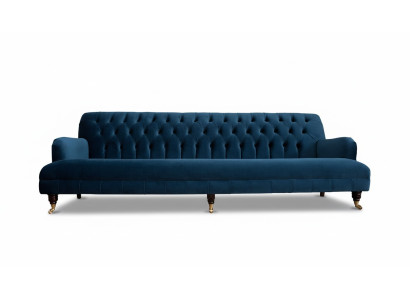 Sofá de diseñador de lujo en estilo Chesterfield con cuatro asientos en color azul.