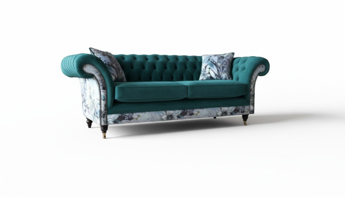 Un sofá de tres plazas de Chesterfield en un vibrante color esmeralda con estampado floral.