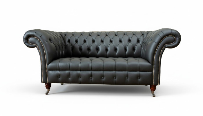 Sofá de cuero Chesterfield de dos plazas para diseñadores.