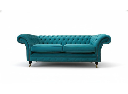 Sofá tapizado Chesterfield de tres plazas de tela azul diseño salón