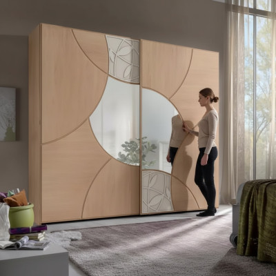 Armario con puertas correderas para dormitorio de madera color marrón con espejo.