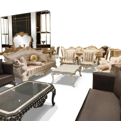 Juego de sala de diseño con sofás, sillones elegantes y mesa de centro moderna.