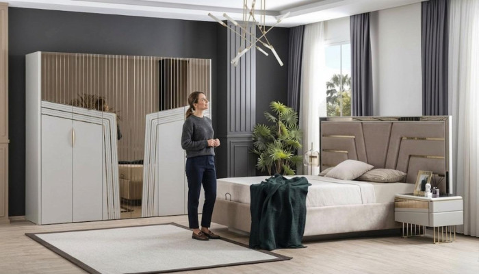 Moderno juego de dormitorio: cama de diseñador, 2 mesitas de noche, armario.