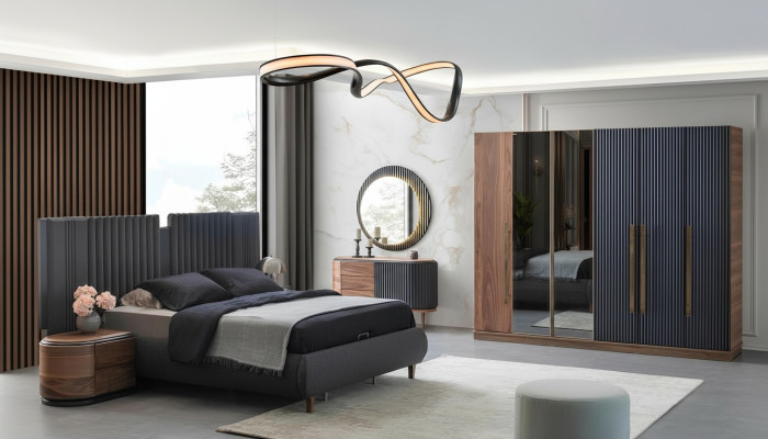 Juego de dormitorio negro y beige con cama doble de diseñador y 2 mesitas de noche.