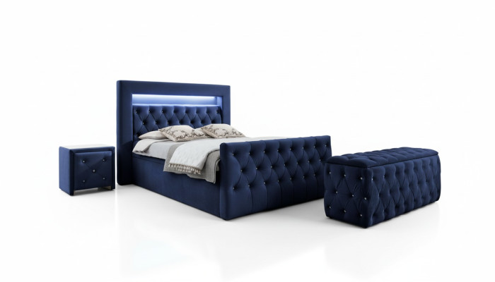 Muebles de dormitorio Chesterfield azul oscuro con cama doble LED y mesitas de noche.