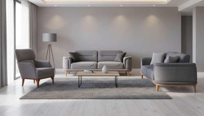 Lujo sala de estar tapizada en gris: Dos sofás de tres plazas y sillón nuevo.