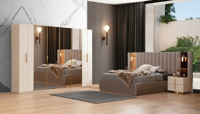 Juego de dormitorio beige con cama de diseñador, armario, y 2 mesitas de noche.
