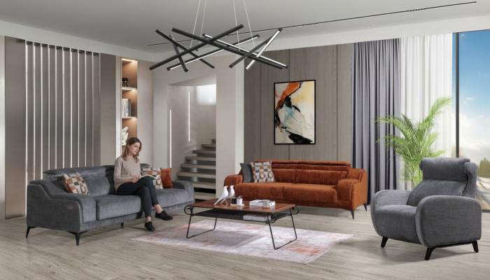 Muebles de asiento exclusivos para la sala de estar en gris y naranja, un sofá de lujo de 3 plazas y un sillón.