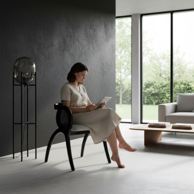 Silla de diseñador gris y negro. Lujoso sillón de una plaza para comedor.