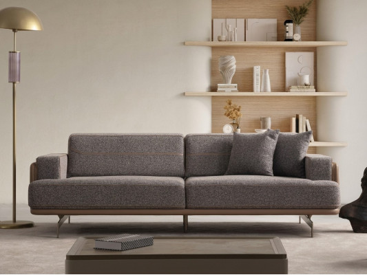 Sofá de diseñador de lujo de tres plazas gris para la sala de estar.