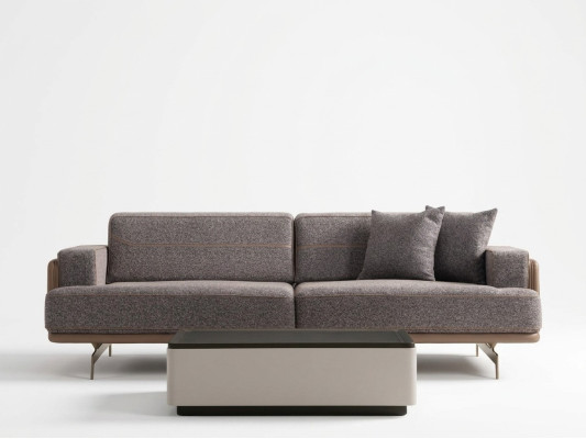 Sofá de diseñador de lujo de tres plazas gris para la sala de estar.