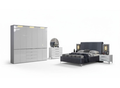 Muebles de dormitorio blancos. Cama textil. Armario grande. Mesitas de noche.
