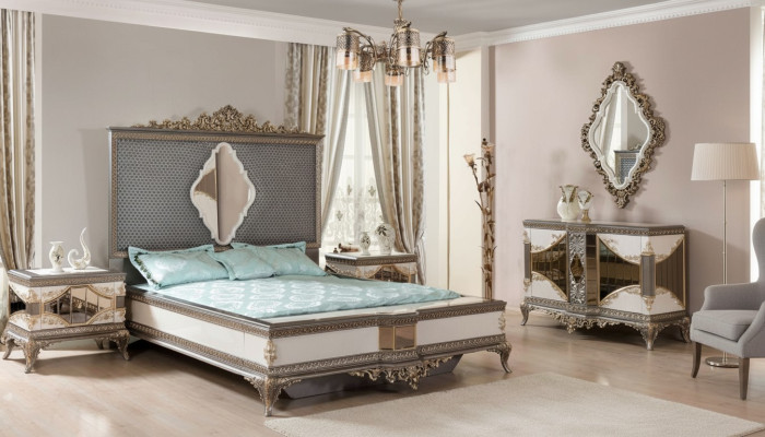 Conjunto de dormitorio clásico de alta calidad con cama doble, cómoda y sofá.