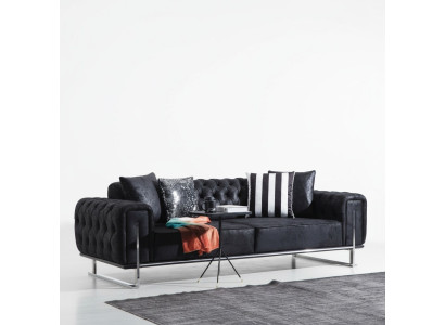 Sofá de tres plazas diseño Chesterfield de lujo para salón.