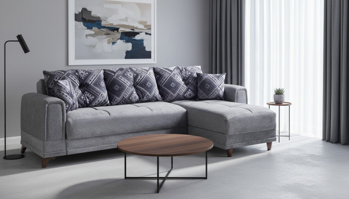 Sofá esquinero gris en forma de L, moderno para salón.