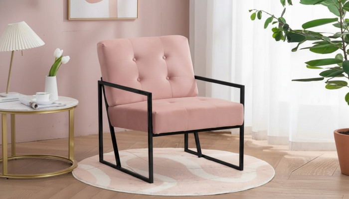 Cómodo sillón de 1 plaza para sala de estar en rosa con tapizado textil y patas de metal.