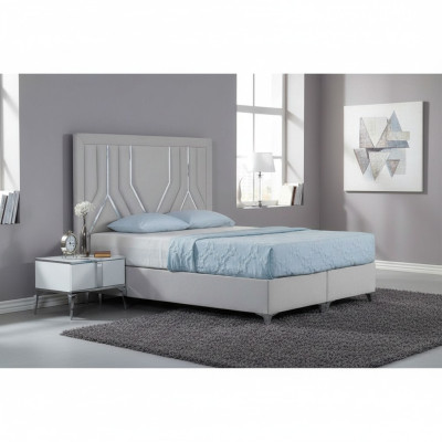 Juego de dormitorio moderno blanco con cama tapizada y mesitas de noche